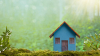 Immobilier écologique - Une maison en bois posée sur de la mousse de forêt